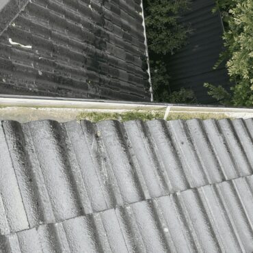 Gutter cleaning in progress